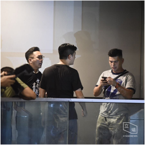 Undercover policeman exposed among protesters, pushed a female protester then ran back into HKPHQ