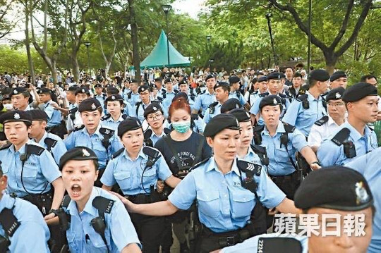 Tens of police officers guarded the public toilet and escorted Chinese female prostitute away