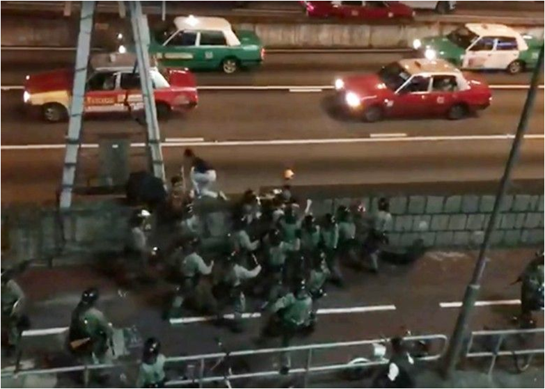 Protesters are being chased off onto the highway