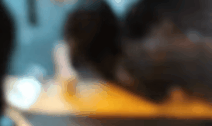 Police officer kicks a subdued female protester in her head.