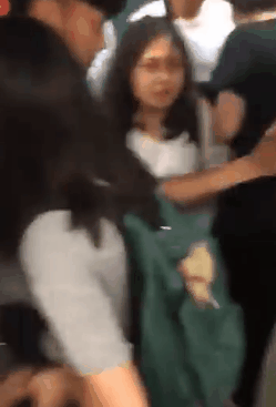 Male officer slaps a woman’s breasts