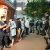 Riot police accuse people waiting outside restaurant of illegal assembly