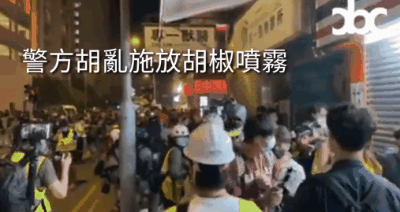 Riot police pepper sprayed a group of press arbitrarily, and wrapped arm around journalist’s neck to take him for search