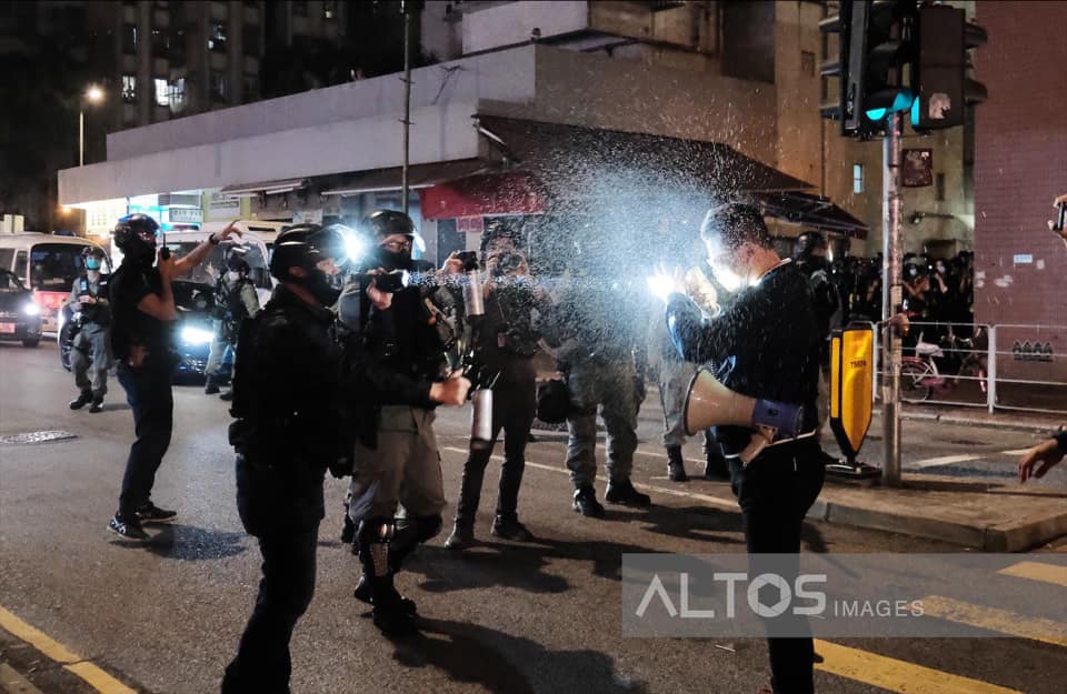 Legislative Council members called on police to remain calm, but got shot in the face by police with pepper spray