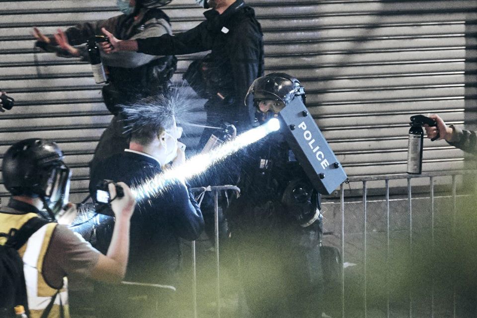 Legislative Council members called on police to remain calm, but got shot in the face by police with pepper spray