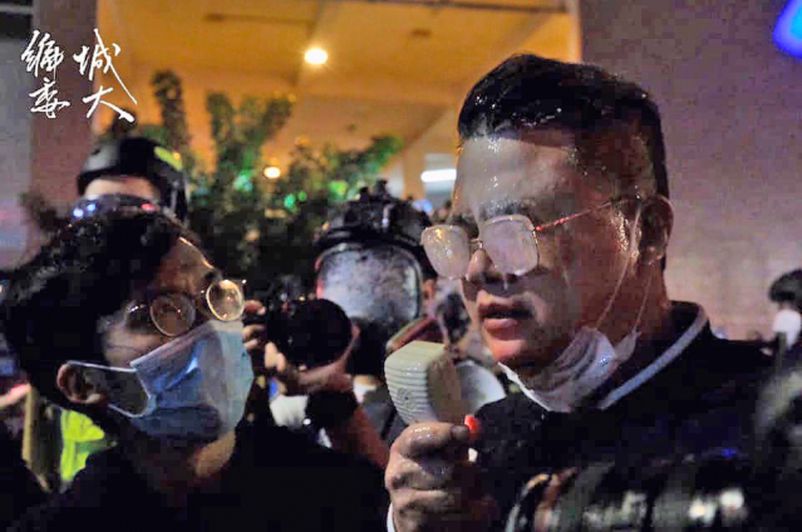 Legislative Council members called on police to remain calm, but got shot in the face by police with pepper spray