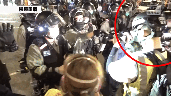 The reporter’s mask pulled by out-of-control police officer during coverage