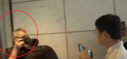 1004 Foreigner closed door at scene of protest and was accused of disruption of public conduct