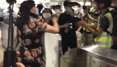 Blue Ribbon Fanatic grabbed a reporter’s phone, assaulted a citizen in front of police officers, who turned a blind eye and escorted her away