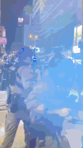 Dozens of police officers takes a man in a torture gesture, and the arrested youth suffers unnecessary pain